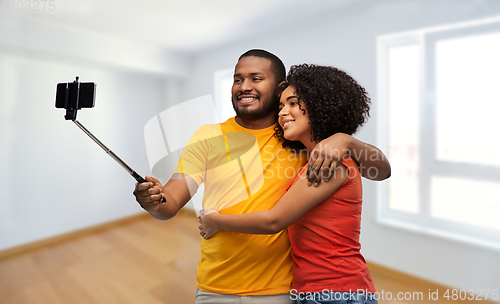 Image of african american couple taking selfie by cellphone