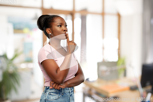 Image of african american woman with finger on lips