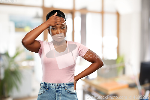 Image of african american woman having headache or fever