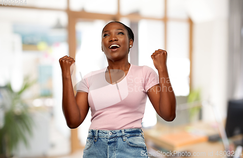 Image of happy african american woman celebrating success