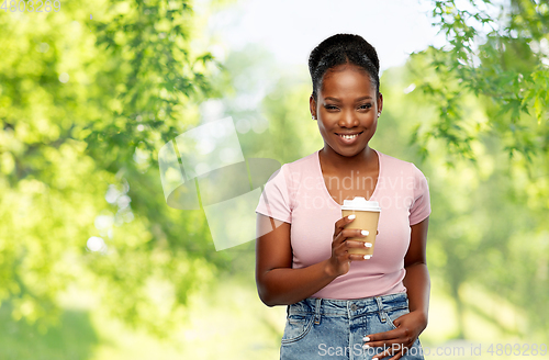 Image of happy african american woman drinking coffee