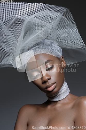 Image of Beautiful african girl with veil hat