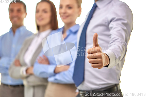 Image of close up of businessman showing thumbs up