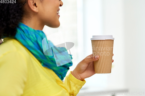 Image of close up of woman holding takeaway coffee cup