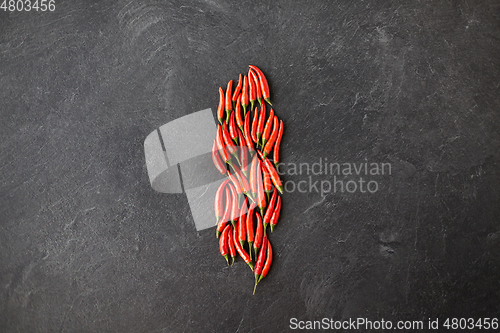 Image of red chili or cayenne pepper on slate stone surface