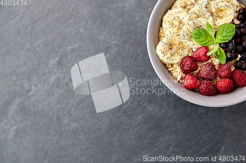 Image of cereal breakfast with berries, banana and mint