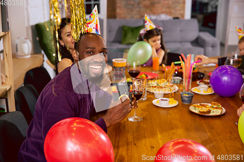 Image of Portrait of happy family celebrating a birthday at home