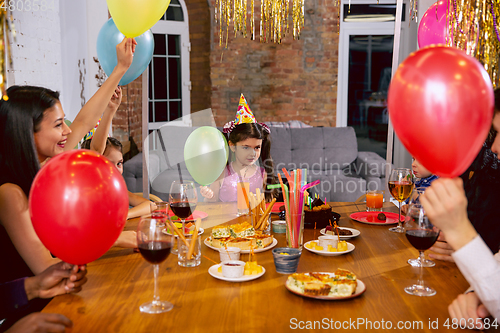 Image of Portrait of happy family celebrating a birthday at home