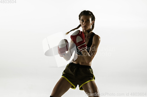 Image of Fit caucasian woman in sportswear boxing isolated on white studio background