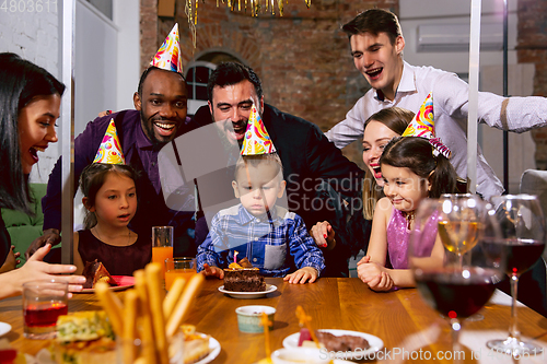 Image of Portrait of happy family celebrating a birthday at home