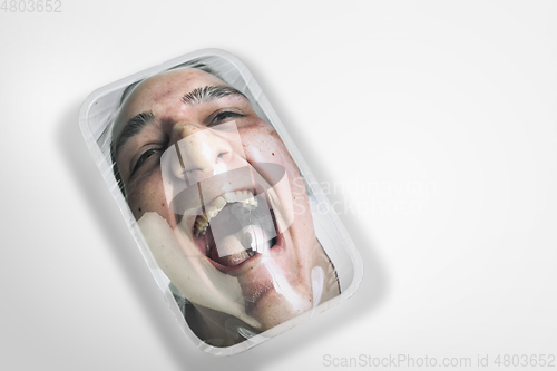 Image of Human head as a goods in plastic box isolated on white background, ecology concept