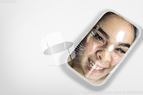 Image of Human head as a goods in plastic box isolated on white background, ecology concept