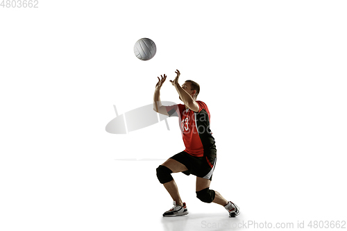 Image of Young caucasian volleyball player placticing isolated on white background