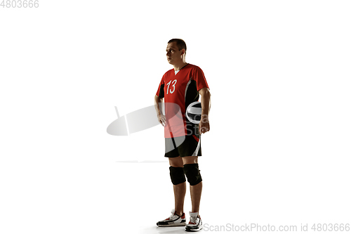 Image of Young caucasian volleyball player placticing isolated on white background