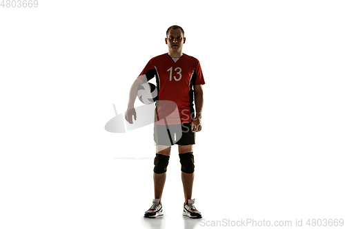 Image of Young caucasian volleyball player placticing isolated on white background