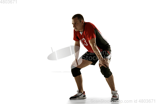 Image of Young caucasian volleyball player placticing isolated on white background