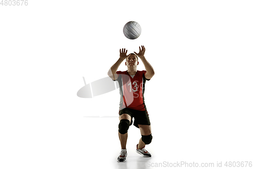 Image of Young caucasian volleyball player placticing isolated on white background