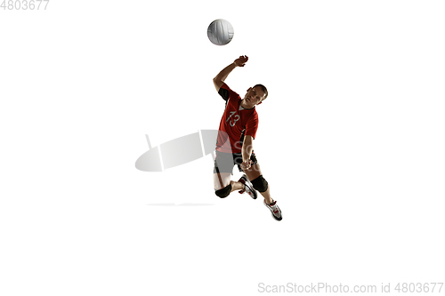 Image of Young caucasian volleyball player placticing isolated on white background