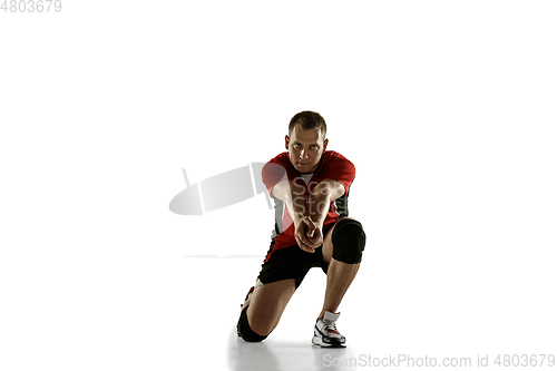 Image of Young caucasian volleyball player placticing isolated on white background