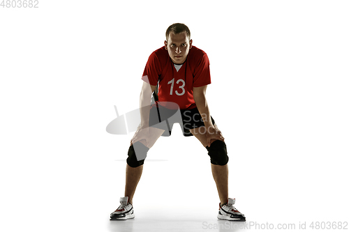 Image of Young caucasian volleyball player placticing isolated on white background