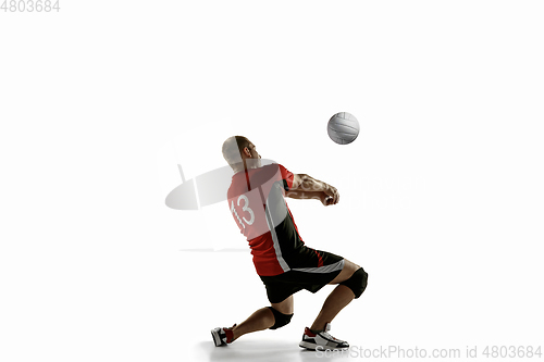 Image of Young caucasian volleyball player placticing isolated on white background