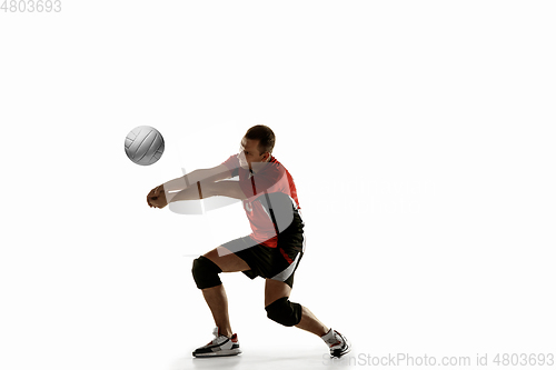 Image of Young caucasian volleyball player placticing isolated on white background