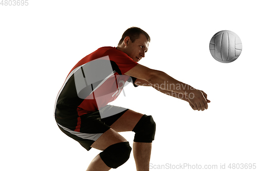 Image of Young caucasian volleyball player placticing isolated on white background