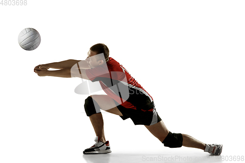 Image of Young caucasian volleyball player placticing isolated on white background