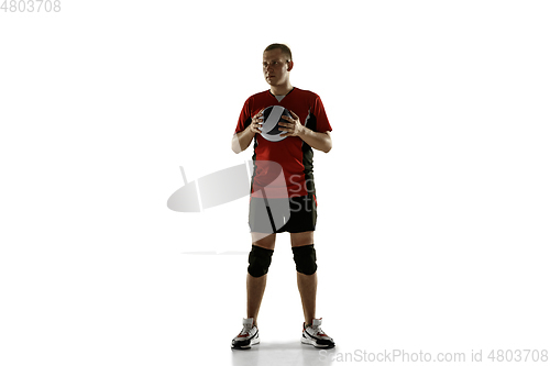 Image of Young caucasian volleyball player placticing isolated on white background