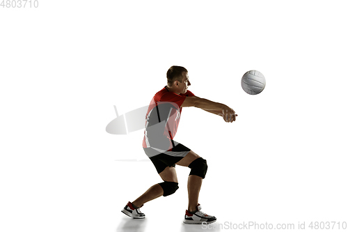 Image of Young caucasian volleyball player placticing isolated on white background