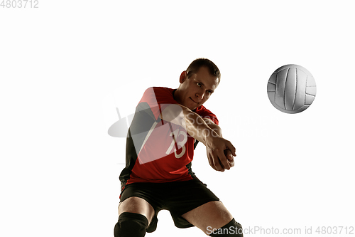 Image of Young caucasian volleyball player placticing isolated on white background