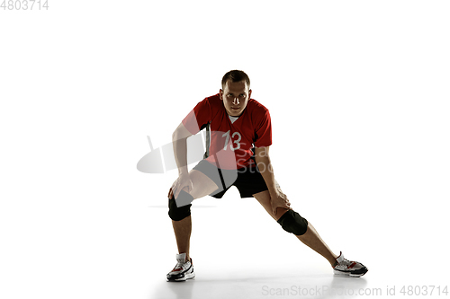 Image of Young caucasian volleyball player placticing isolated on white background