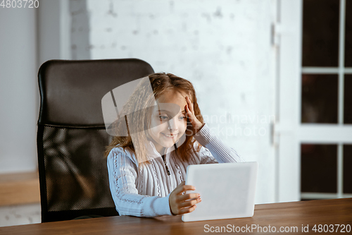 Image of Portrait of young caucasian girl in casual clothes looks dreamful and happy