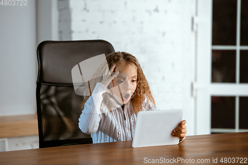 Image of Portrait of young caucasian girl in casual clothes looks dreamful and happy