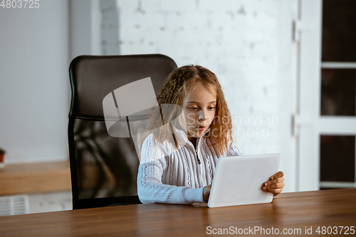 Image of Portrait of young caucasian girl in casual clothes looks dreamful and happy