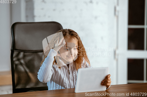 Image of Portrait of young caucasian girl in casual clothes looks dreamful and happy