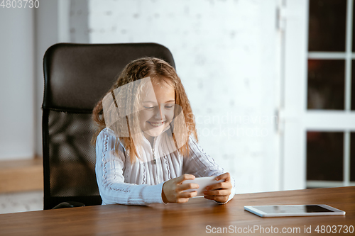 Image of Portrait of young caucasian girl in casual clothes looks dreamful and happy