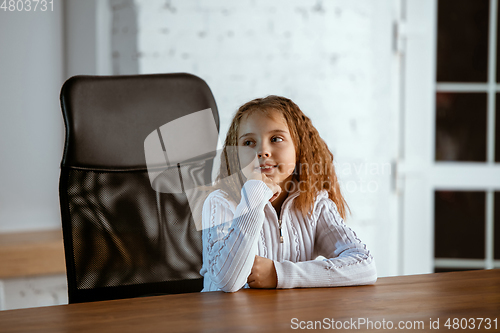 Image of Portrait of young caucasian girl in casual clothes looks dreamful and happy