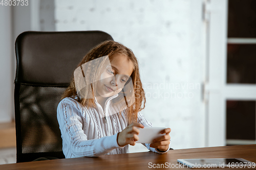 Image of Portrait of young caucasian girl in casual clothes looks dreamful and happy