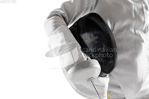 Image of Teen girl in fencing costume with sword in hand isolated on white background