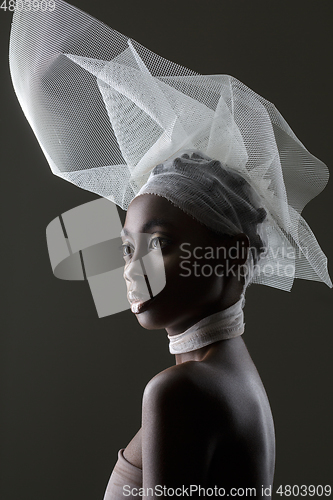 Image of Beautiful african girl with veil hat