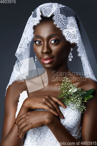 Image of Beautiful african girl with veil hat