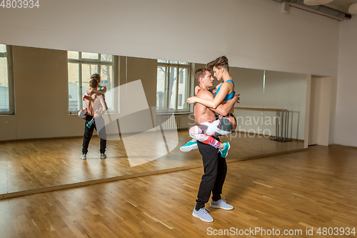 Image of modern dancers practicing in dance studio