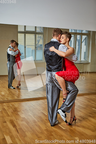 Image of beautiful couple dancing tango