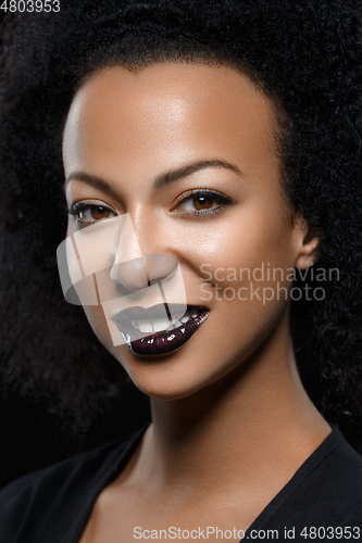 Image of beautiful woman with big curly hair