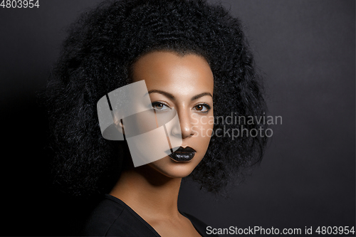 Image of beautiful woman with big curly hair