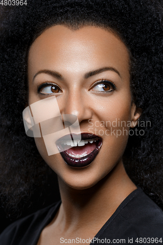 Image of beautiful woman with big curly hair