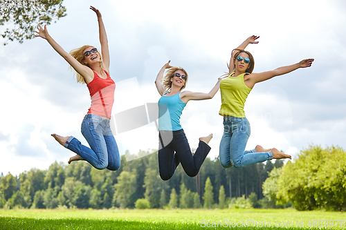 Image of three girls having fun outdoors