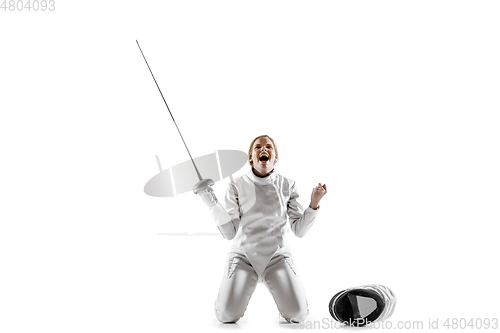 Image of Teen girl in fencing costume with sword in hand isolated on white background