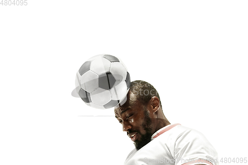 Image of Close up of emotional man playing soccer hitting the ball with the head on isolated white background